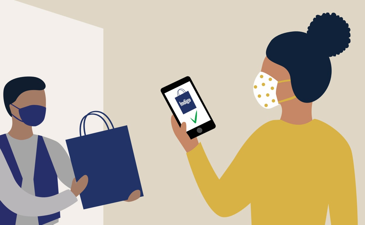 An illustration of a customer picking up a shopping bag from a customer service representative using the Indigo app.