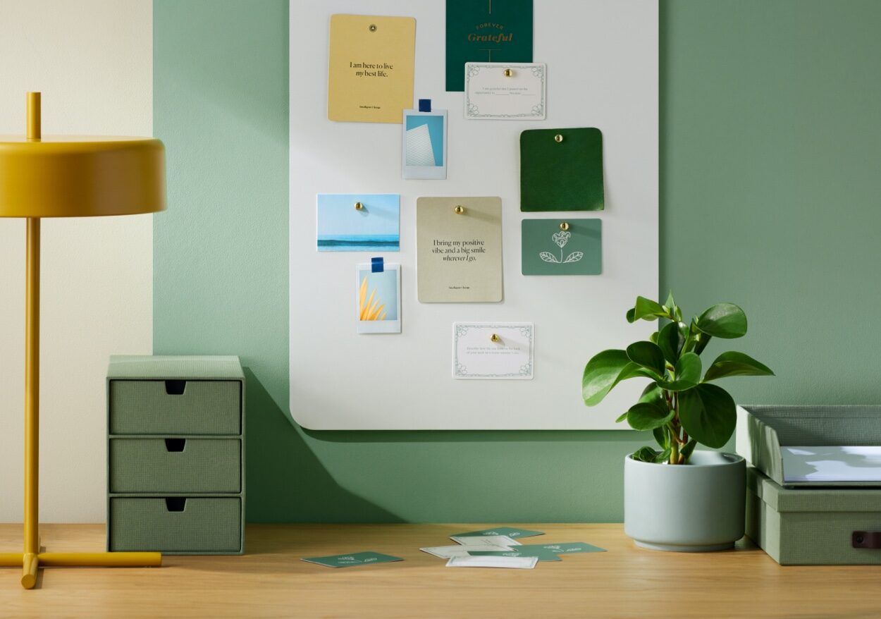 An organized desk with Bigso storage and magnetic bulletin board.