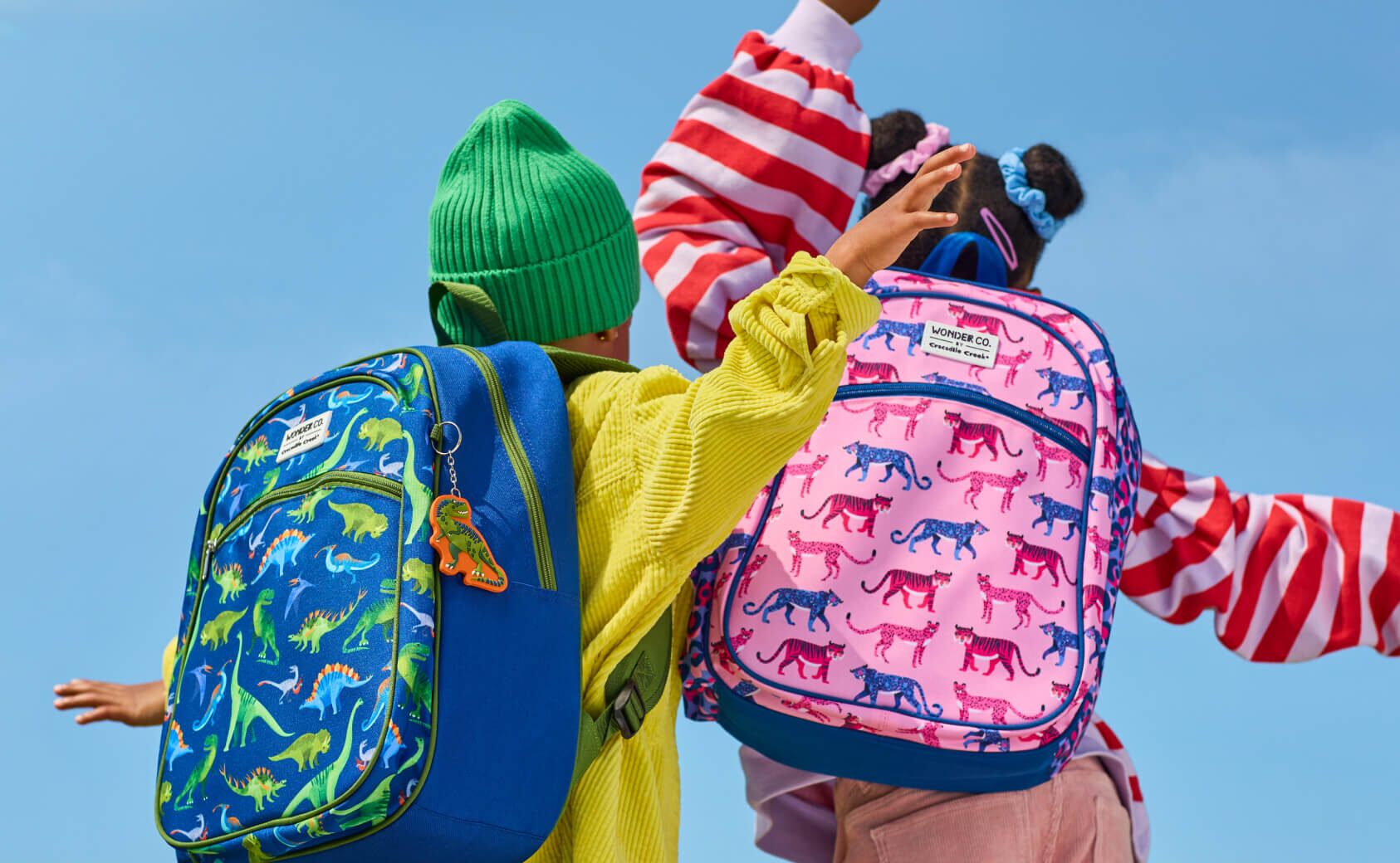 Two children wearing backpacks.
