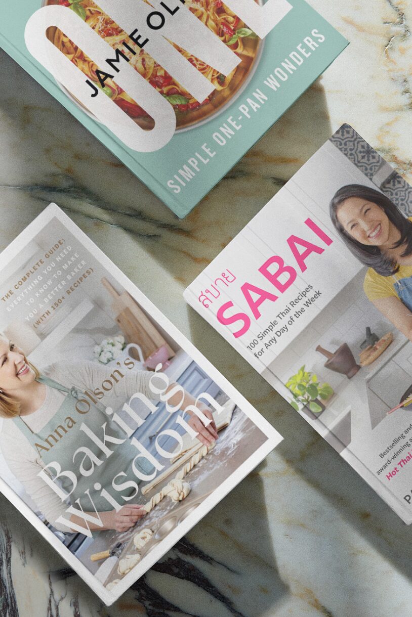 Three cookbooks placed on a countertop