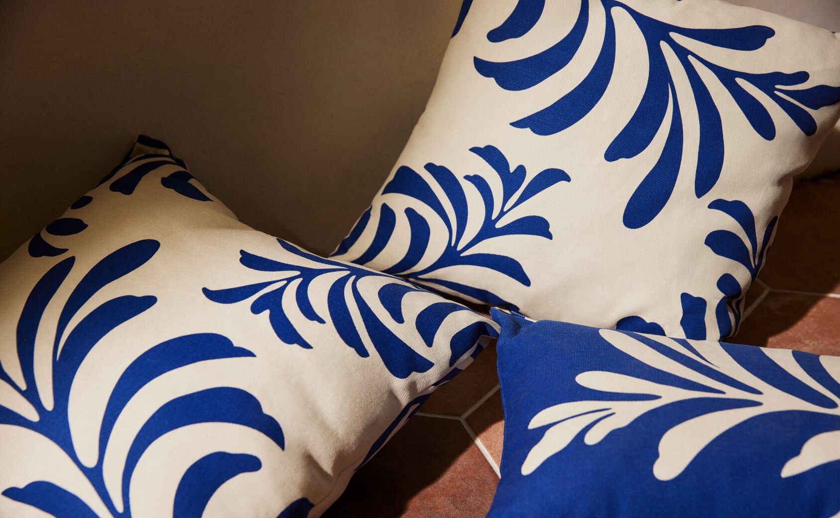 Outdoor pillows in blue and white.