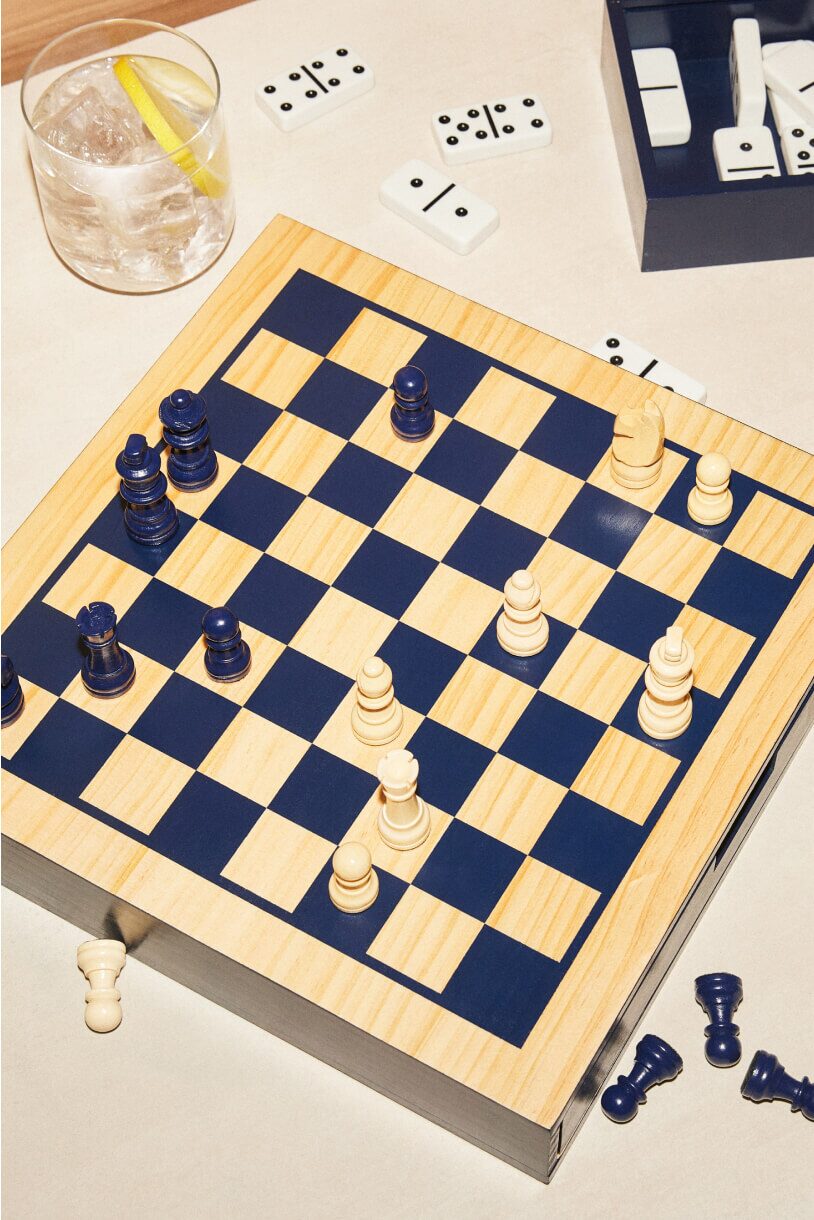 A selection of classic gifts including a wooden chess set.