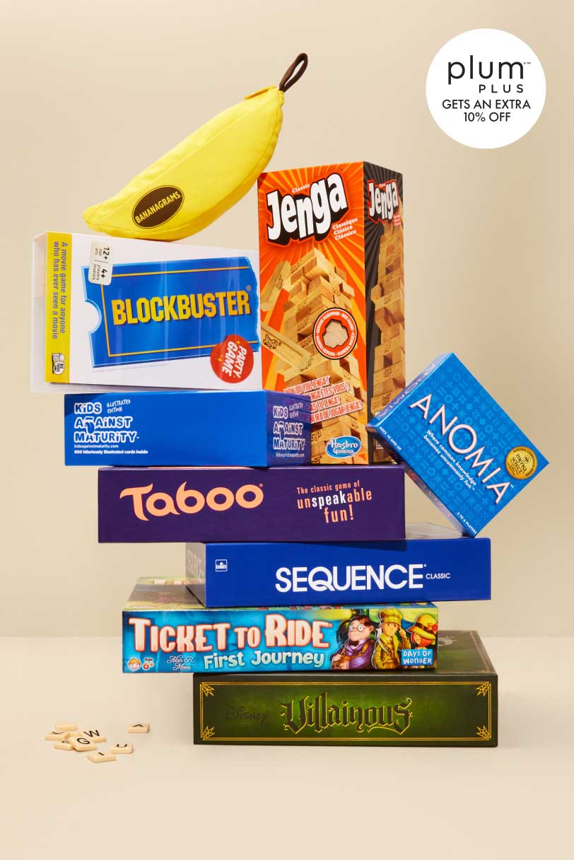 A stack of board games and puzzles